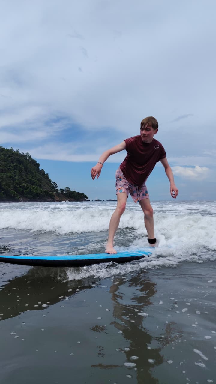 Surfer paddling in warm water