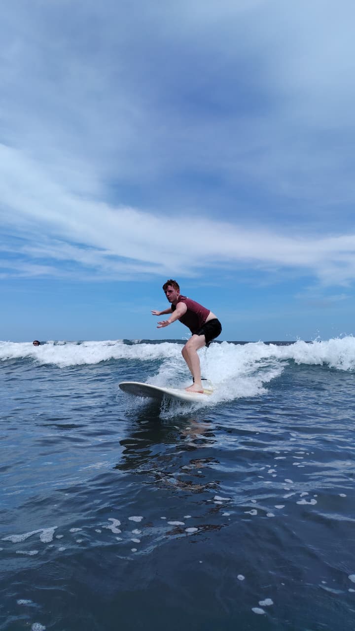 Surfing at golden hour in Jacó