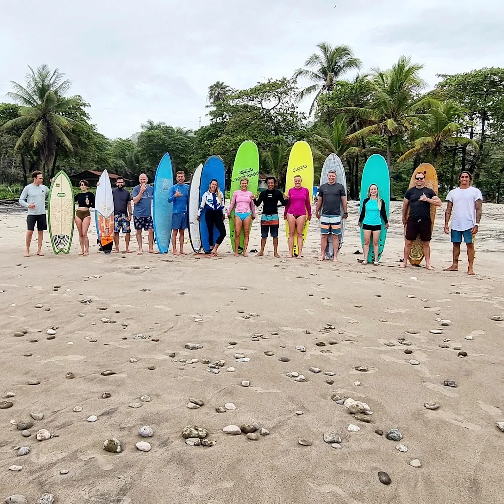 Student riding a wave at Playa Jacó